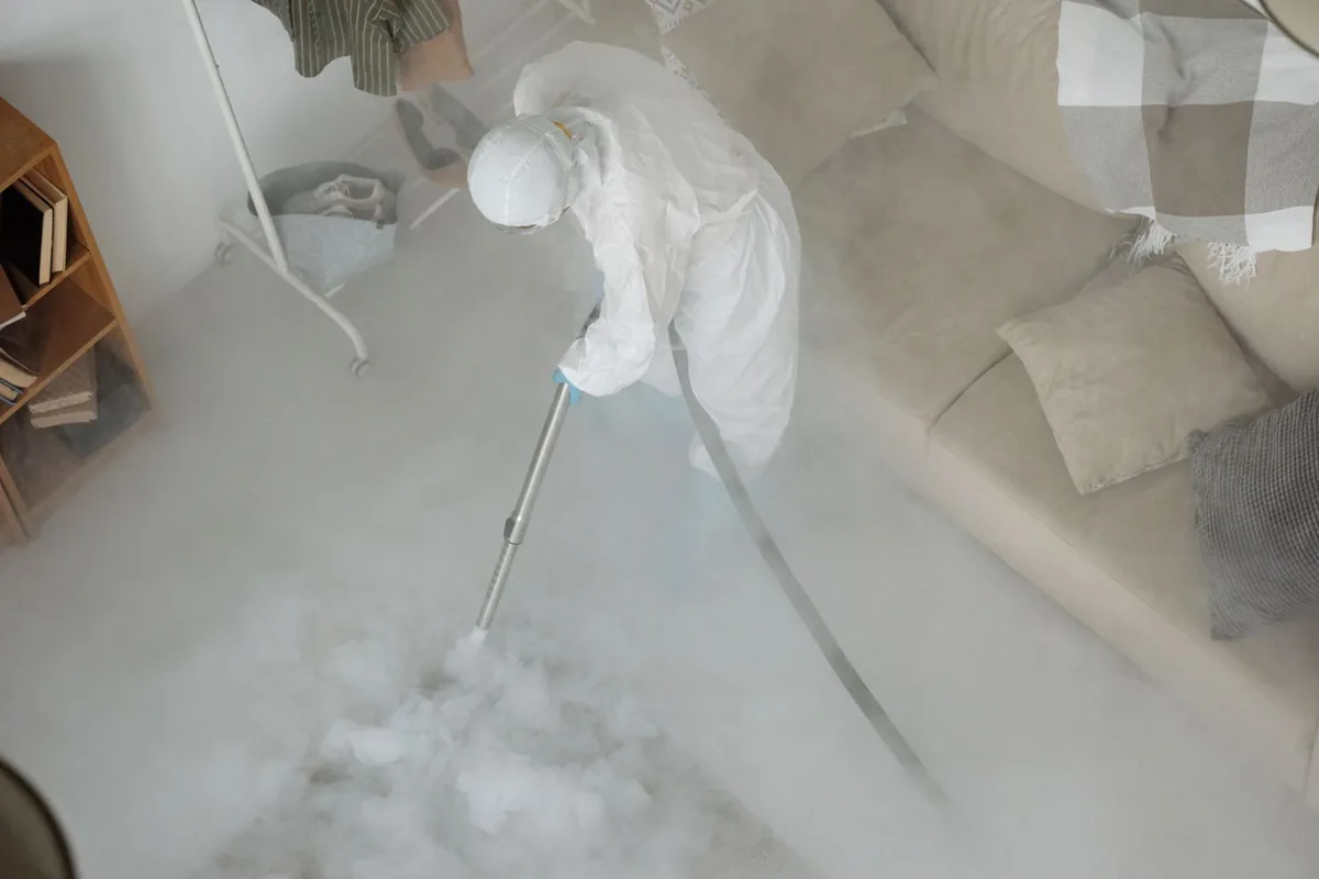 Biohazard cleanup technician in protective equipment, Coffeyville, KS